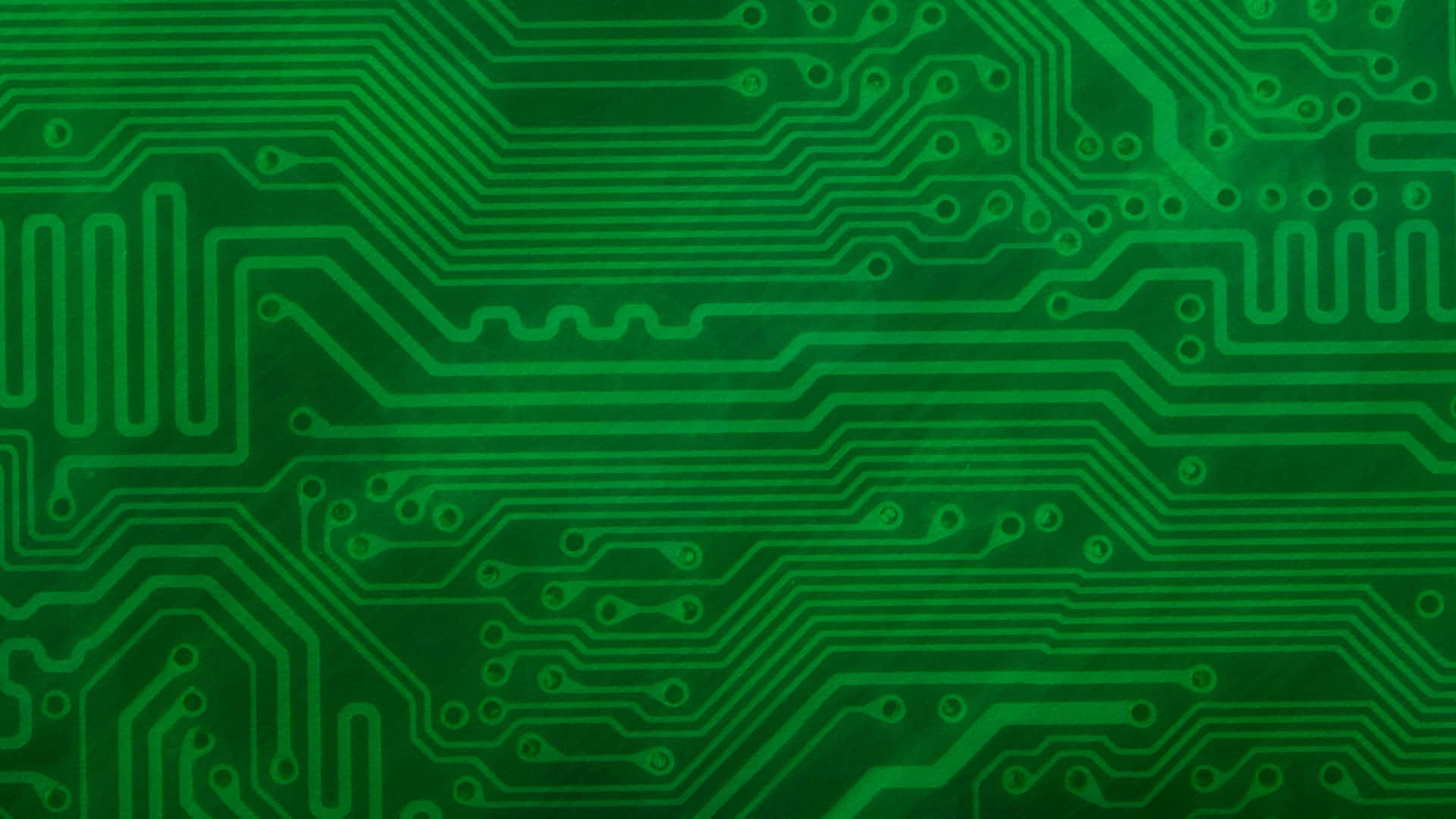 A Green Circuit Board Background Photo