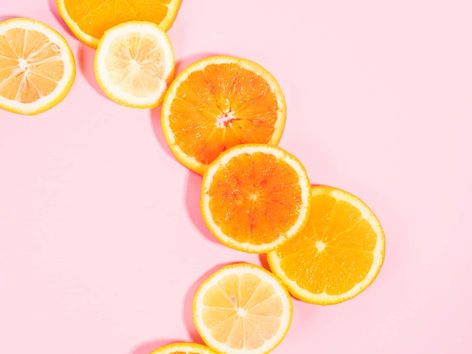 Citrus Splash Pink Background Wallpaper