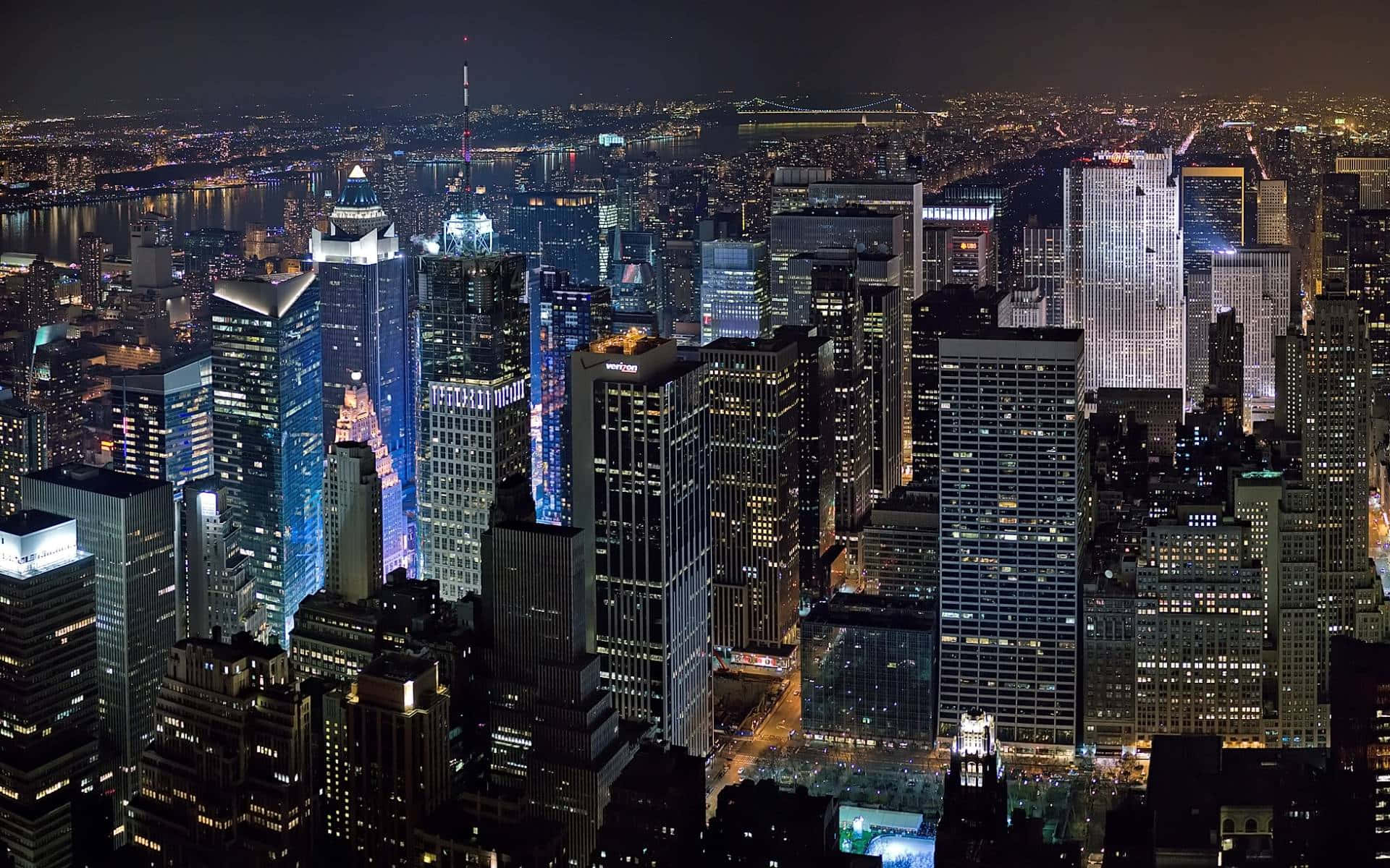 Fotosda Cidade De Nova Iorque À Noite, Incluindo O Empire State Building.