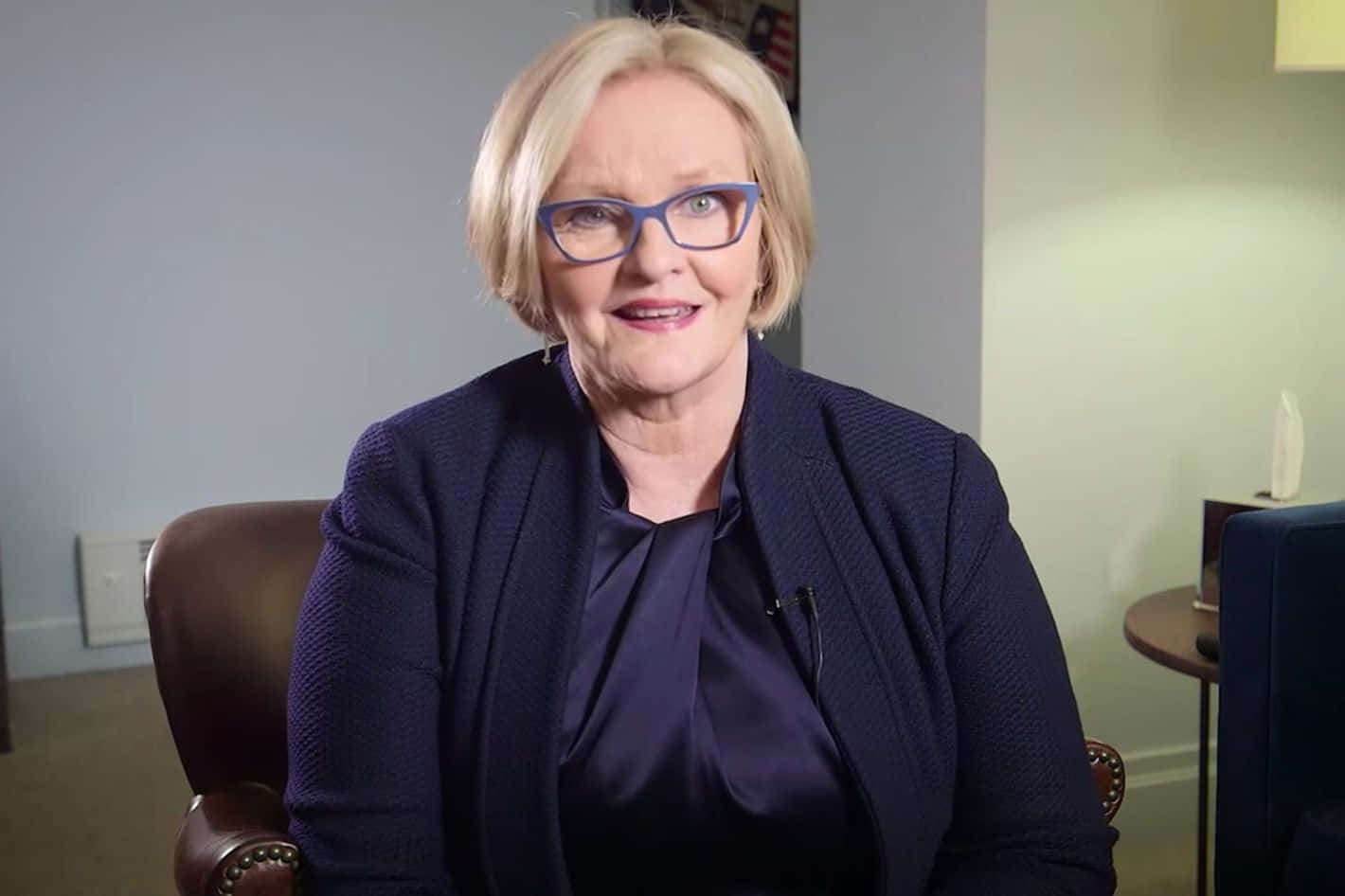 Claire Mccaskill On Armchair Background