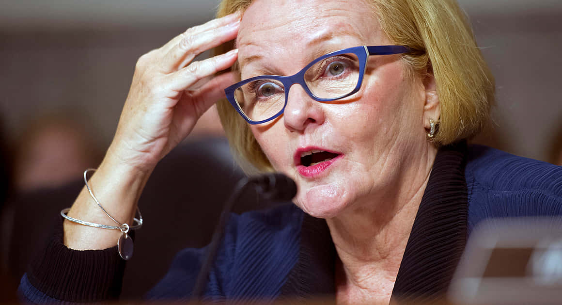Claire Mccaskill Wearing Blue Glasses Background