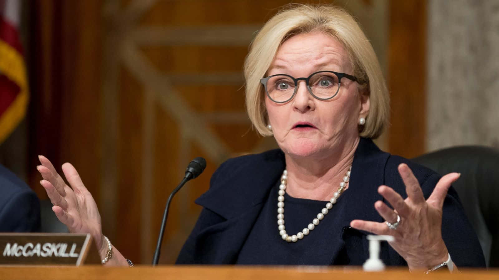 Claire Mccaskill With Open Palms Background