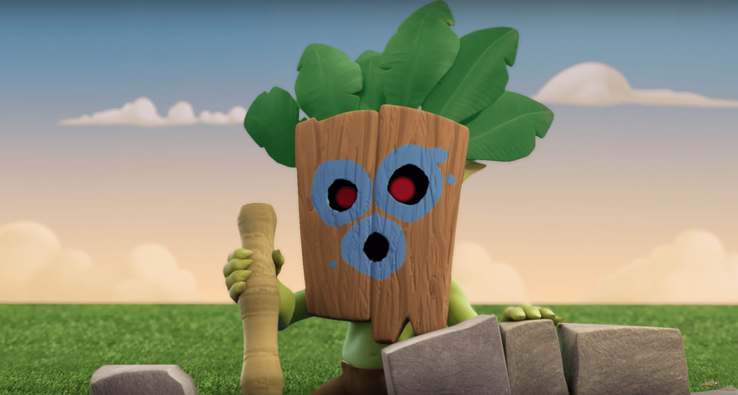 a cartoon character with a green face and a wooden stick Background — A cartoon tree character with red eyes and green leaves holds a club beside stone blocks in a grassy field under a soft sky.