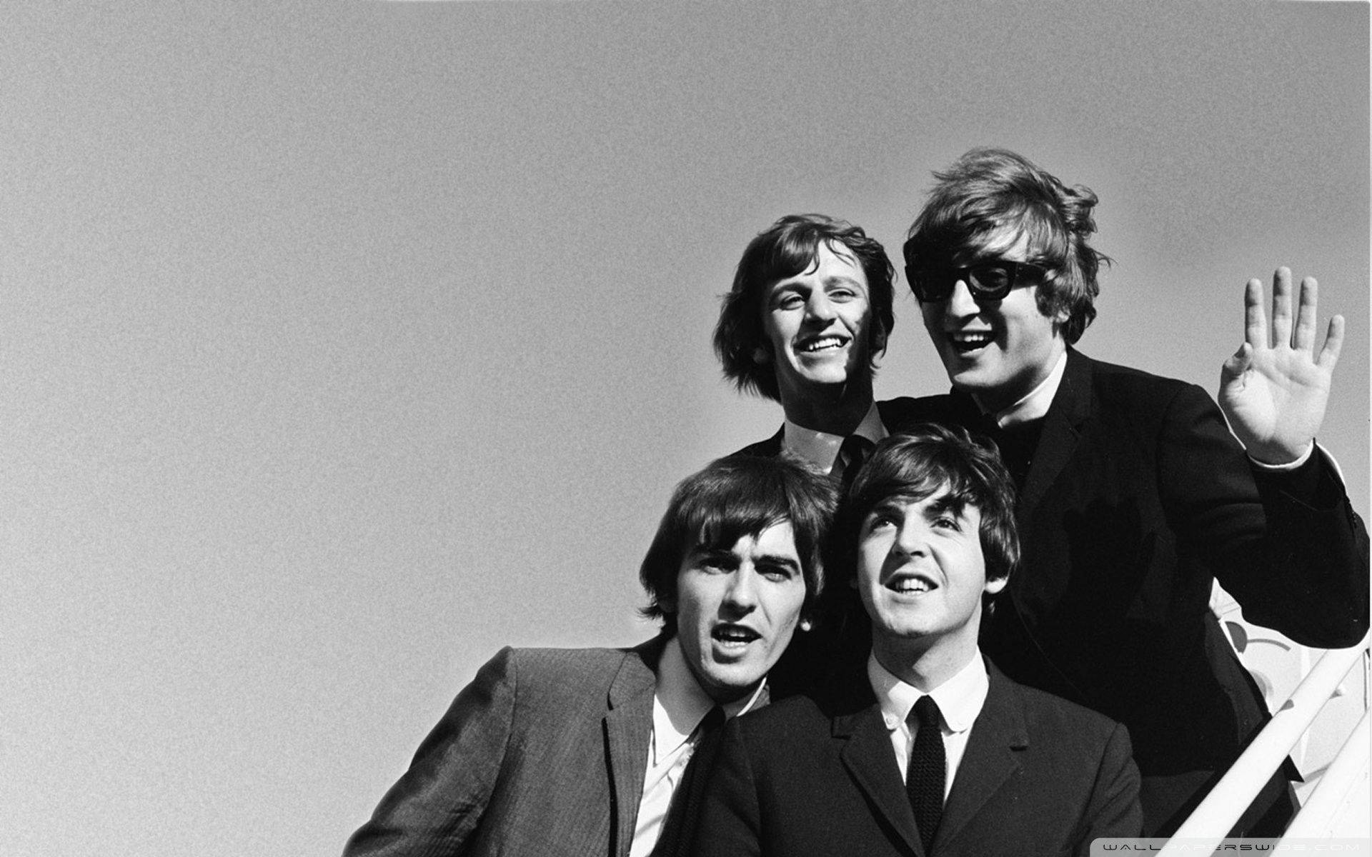 Timeless Charm Of The Beatles In Monochrome Wallpaper