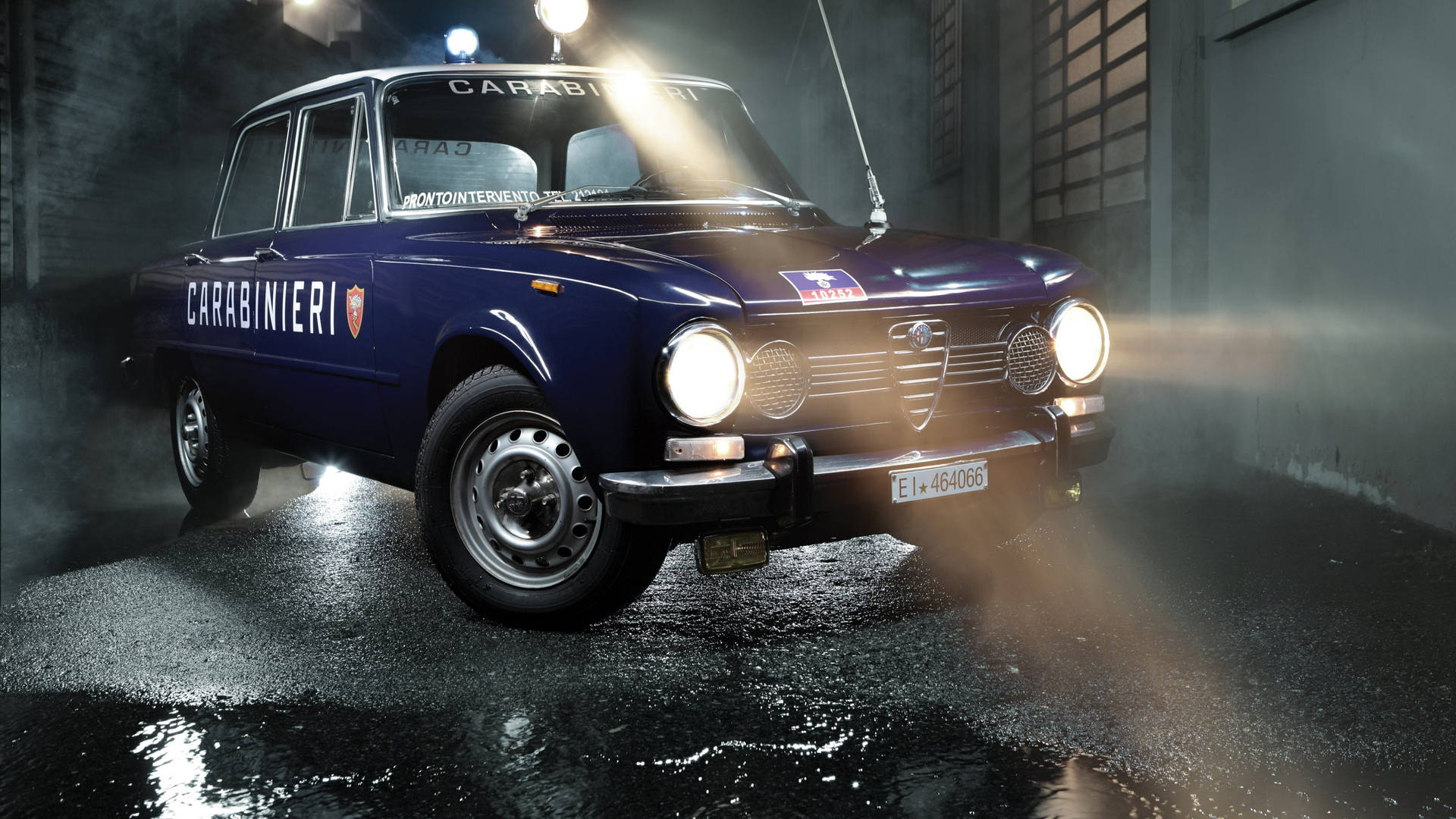 Classic blue Alfa Romeo Giulia car for Carabiniere police wallpaper.