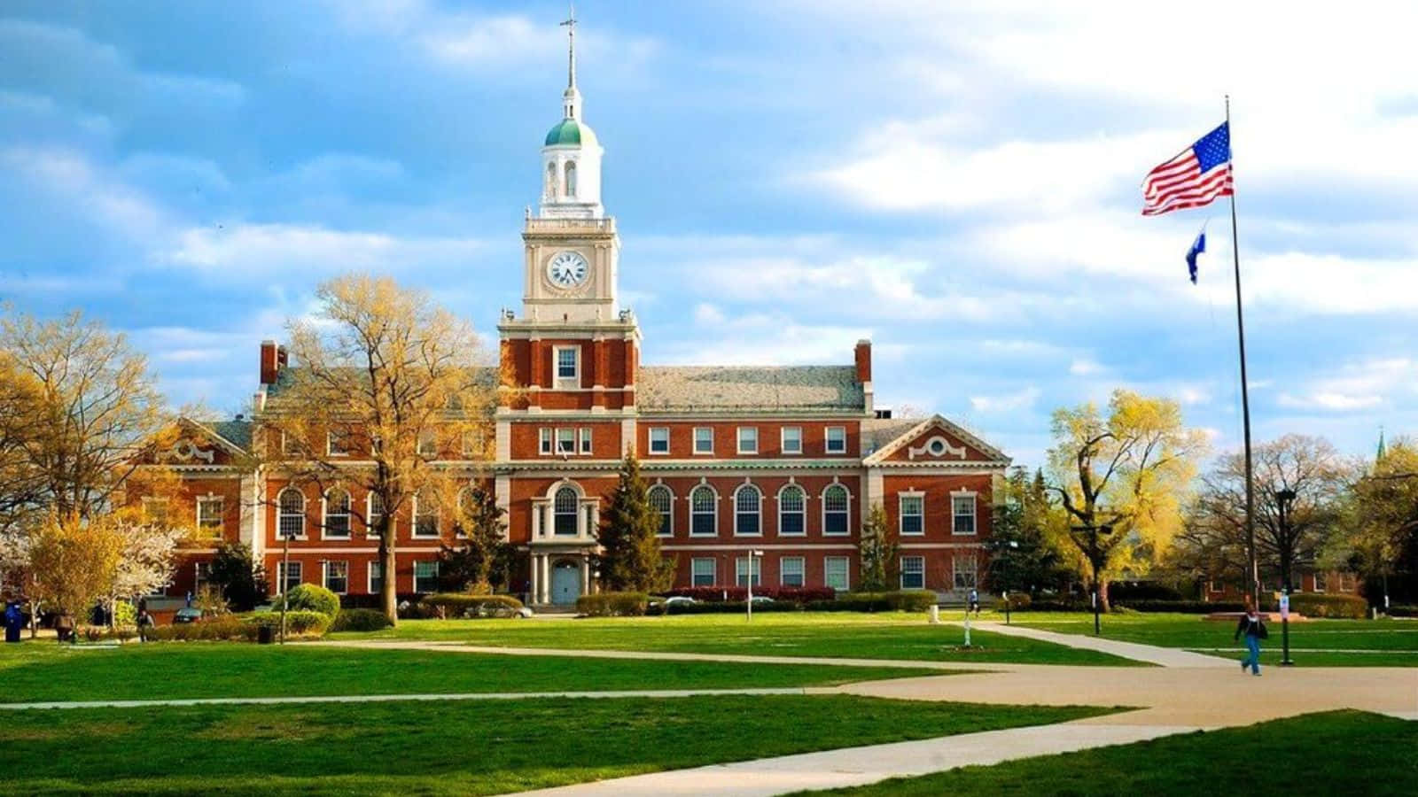 Classic College Buildingwith Clock Tower Wallpaper