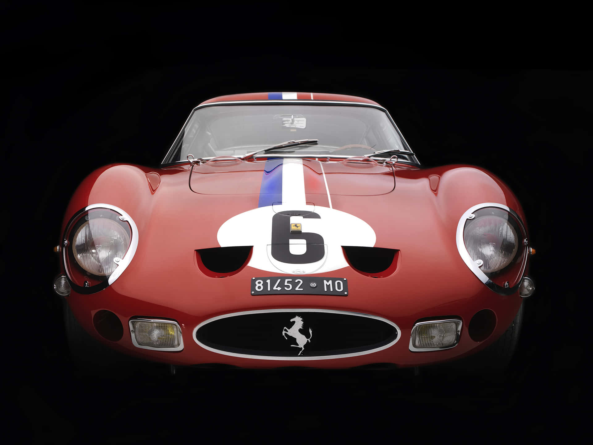 A Red And White Racing Car With The Number '5' On It Wallpaper
