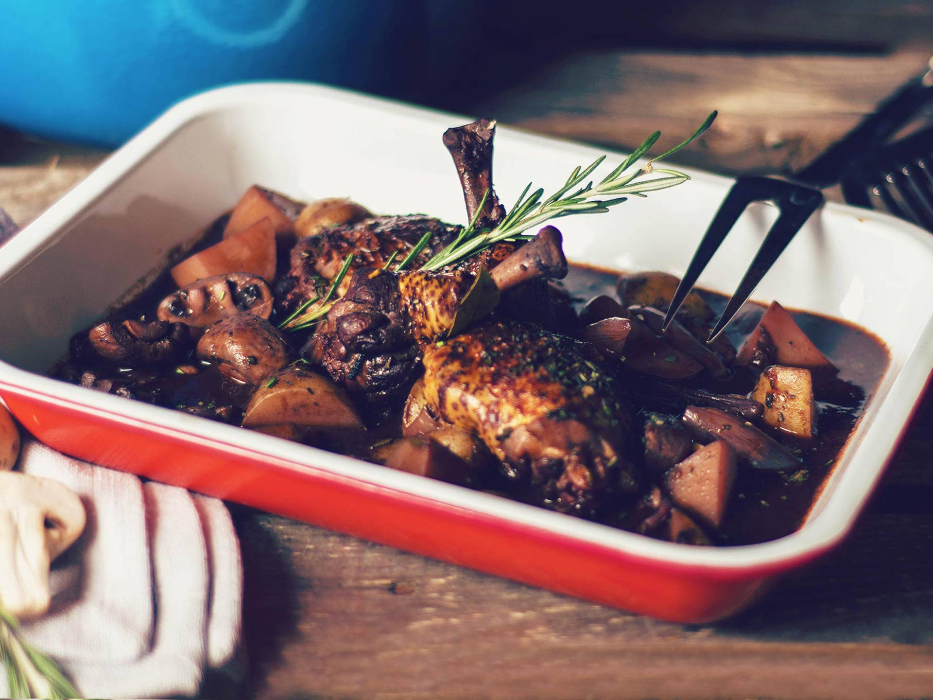 Classic French Coq Au Vin On A Rectangular Plate Wallpaper