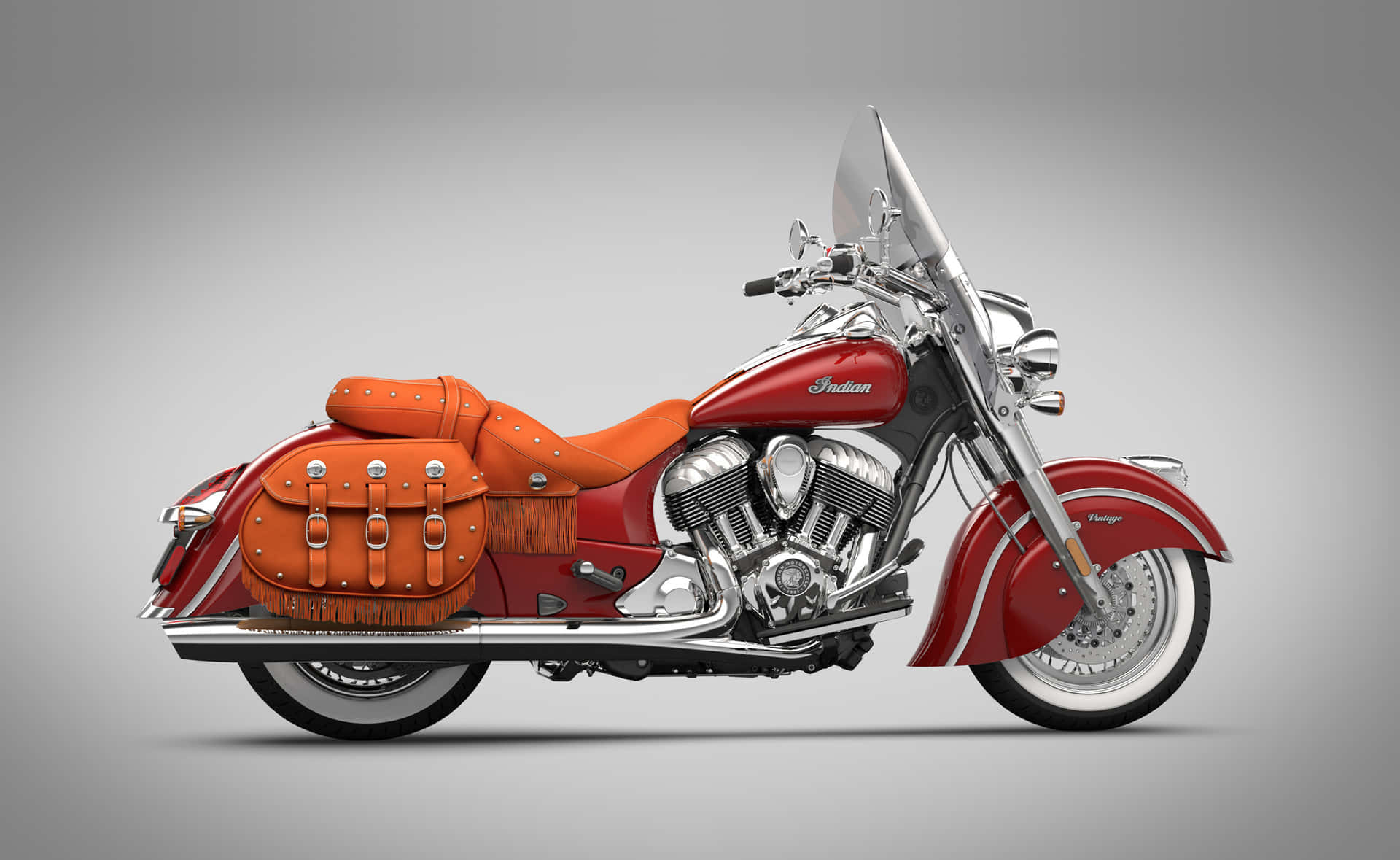 Classic Indian Motorcycle Dominating The Sunset Road Wallpaper