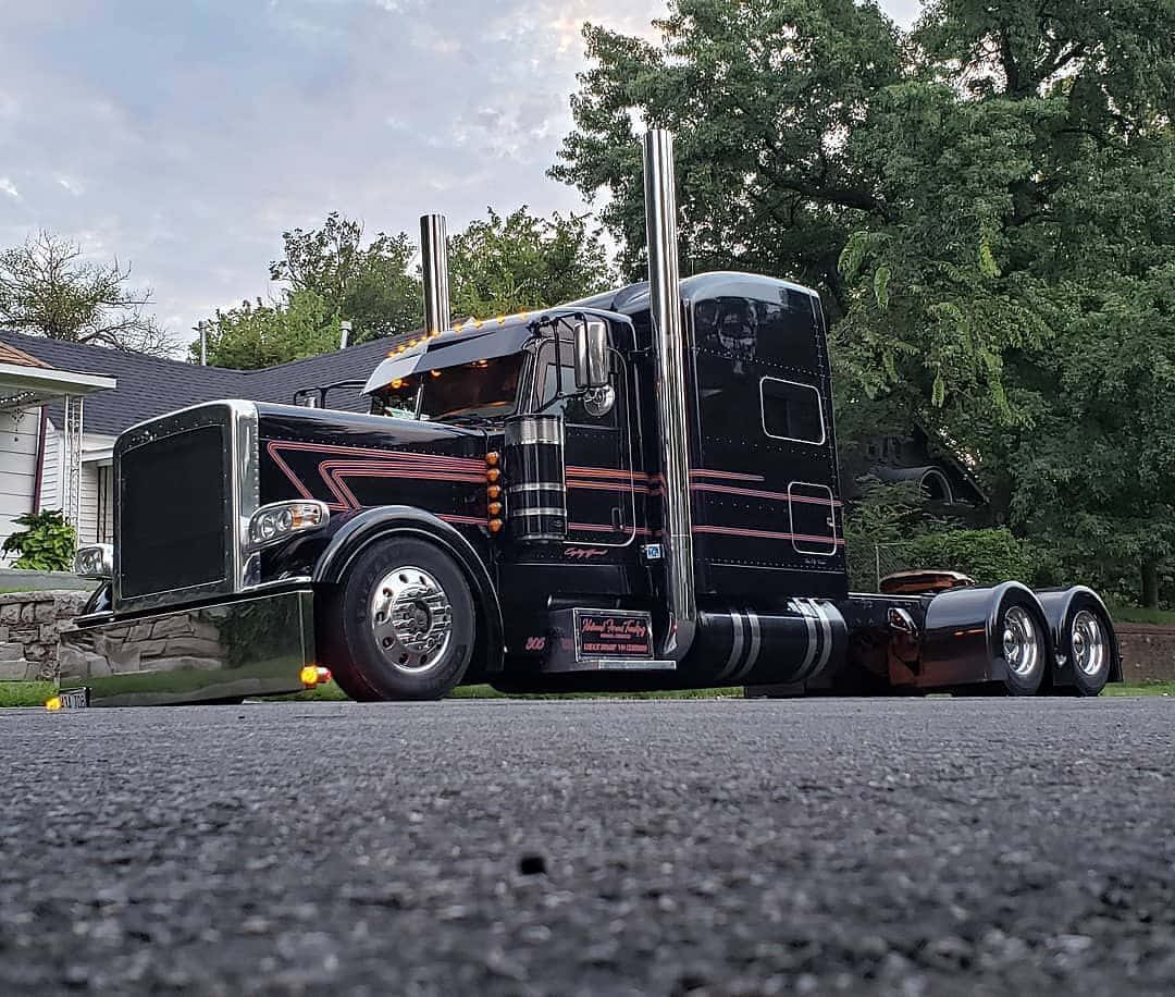 Classic Kenworth K100 Semi-truck On The Open Road Wallpaper