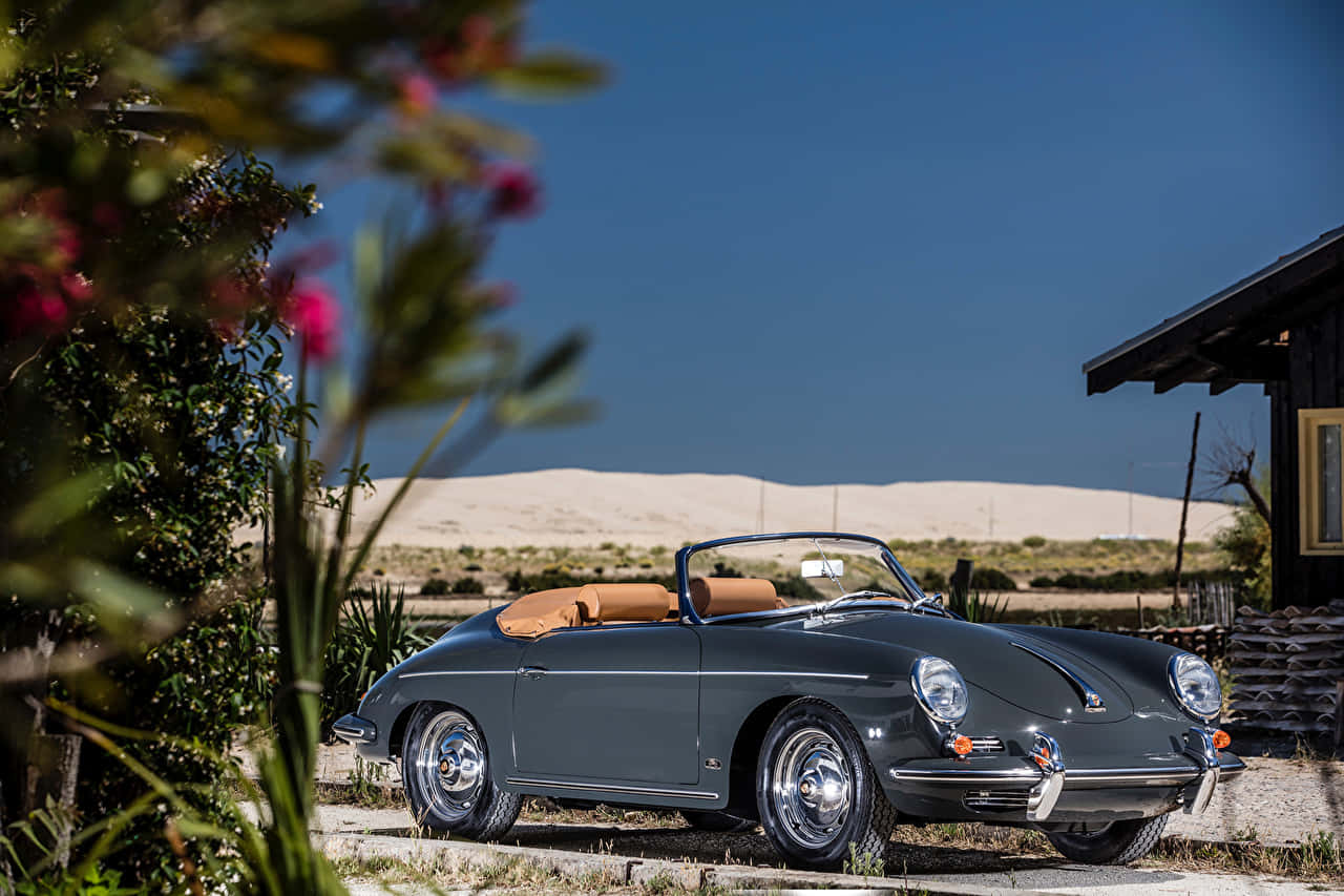 Classic Luxury: 1956 Porsche 356 On The Open Road Wallpaper