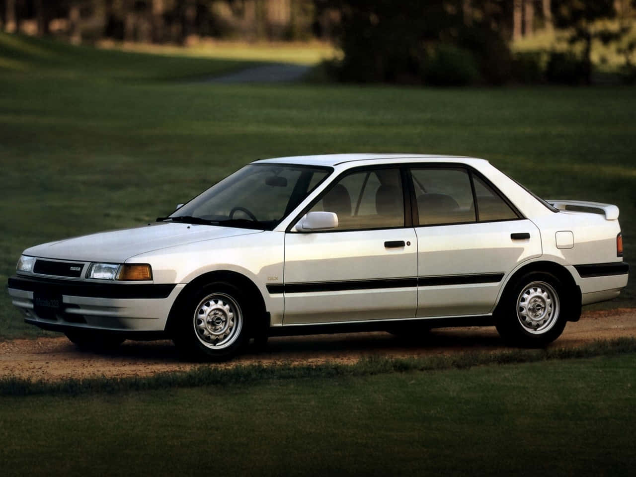 Classic Mazda 323 In Pristine Condition Wallpaper