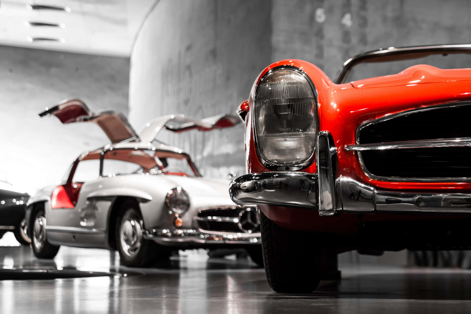 A Group Of Classic Cars In A Museum Wallpaper