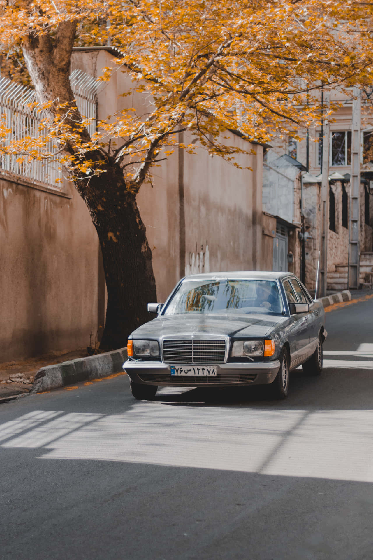 A Mercedes Benz Cls Parked On A Street Wallpaper