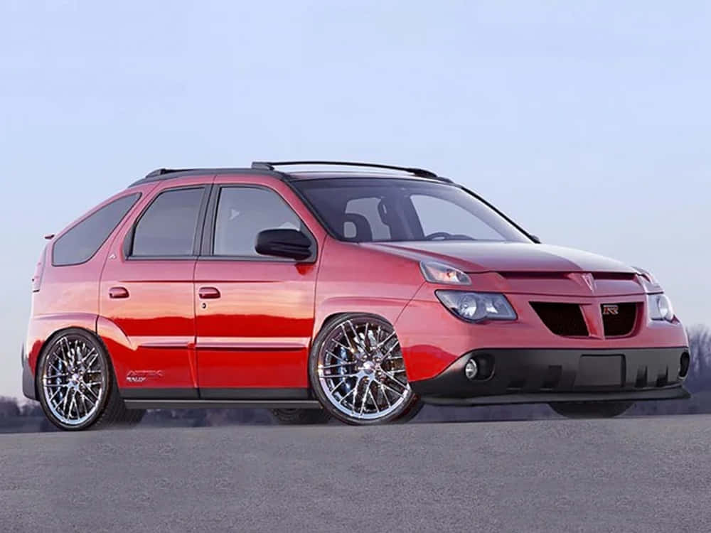 Classic Pontiac Aztek In Vibrant Sunset Wallpaper