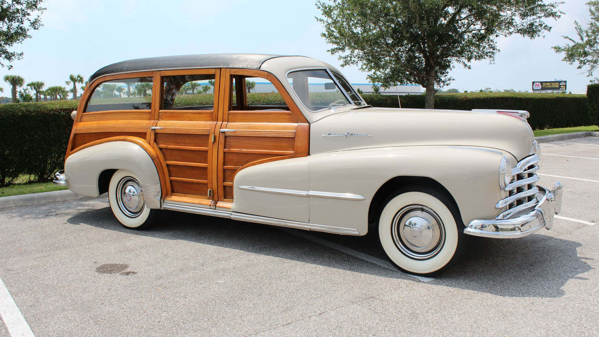 Classic Pontiac Streamliner Parked On Concrete Road Wallpaper