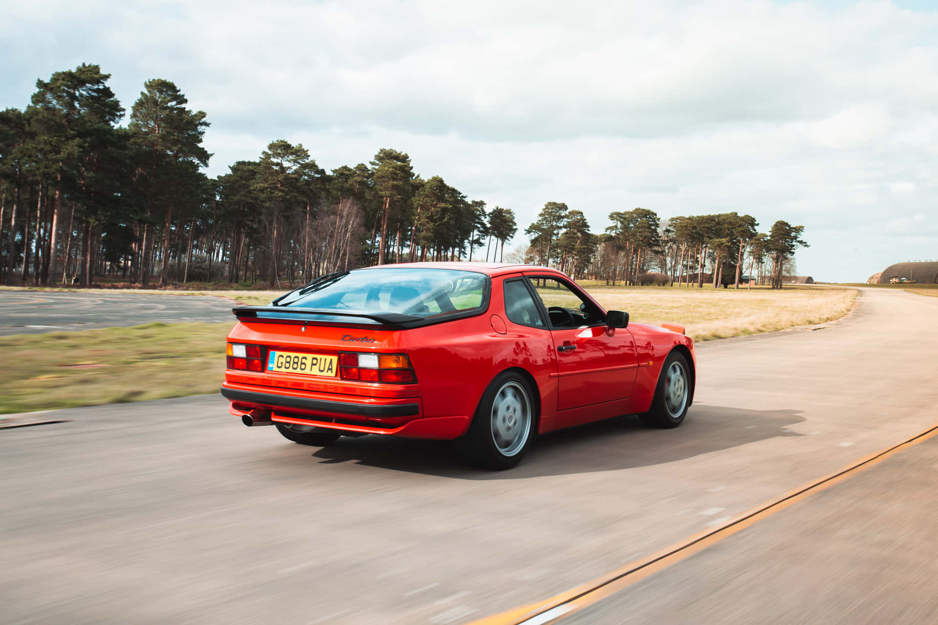 Download Classic Red Porsche 944 On The Road Wallpaper