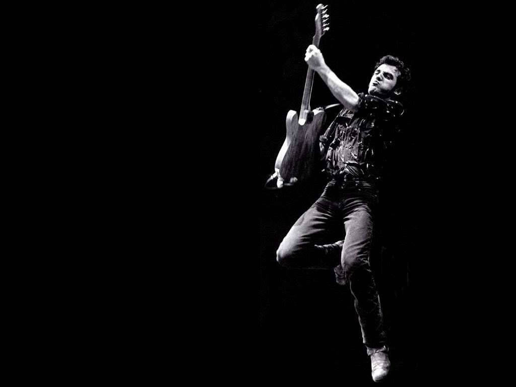 Legendary Rock Icon Bruce Springsteen on Stage Wallpaper