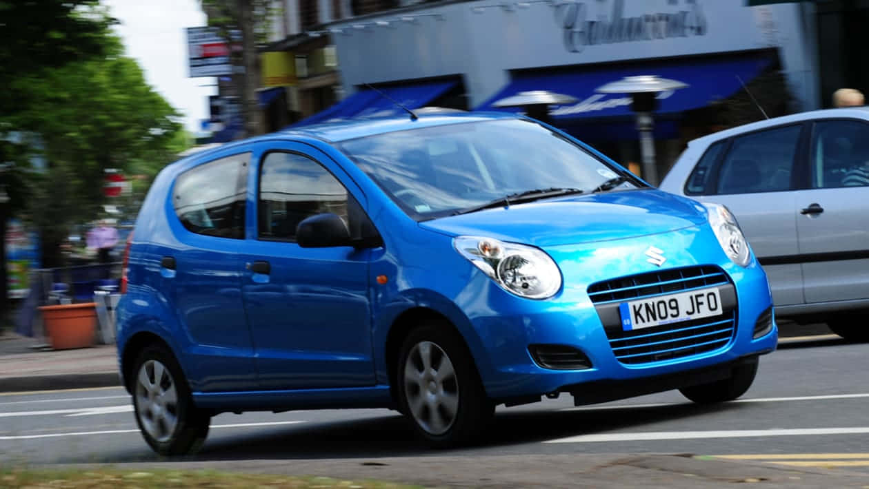 Classic Suzuki Alto Exterior In A Natural Scenic Setting Wallpaper