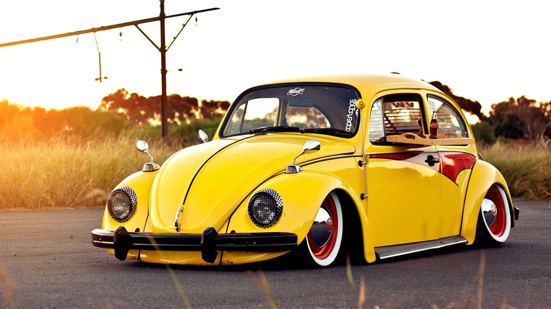 Classic Volkswagen Beetle Glistening In The Midday Sun Wallpaper