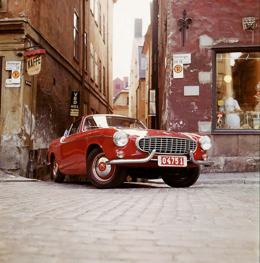 Classic Volvo P1800 - A Timeless Icon Of Automotive Engineering Wallpaper