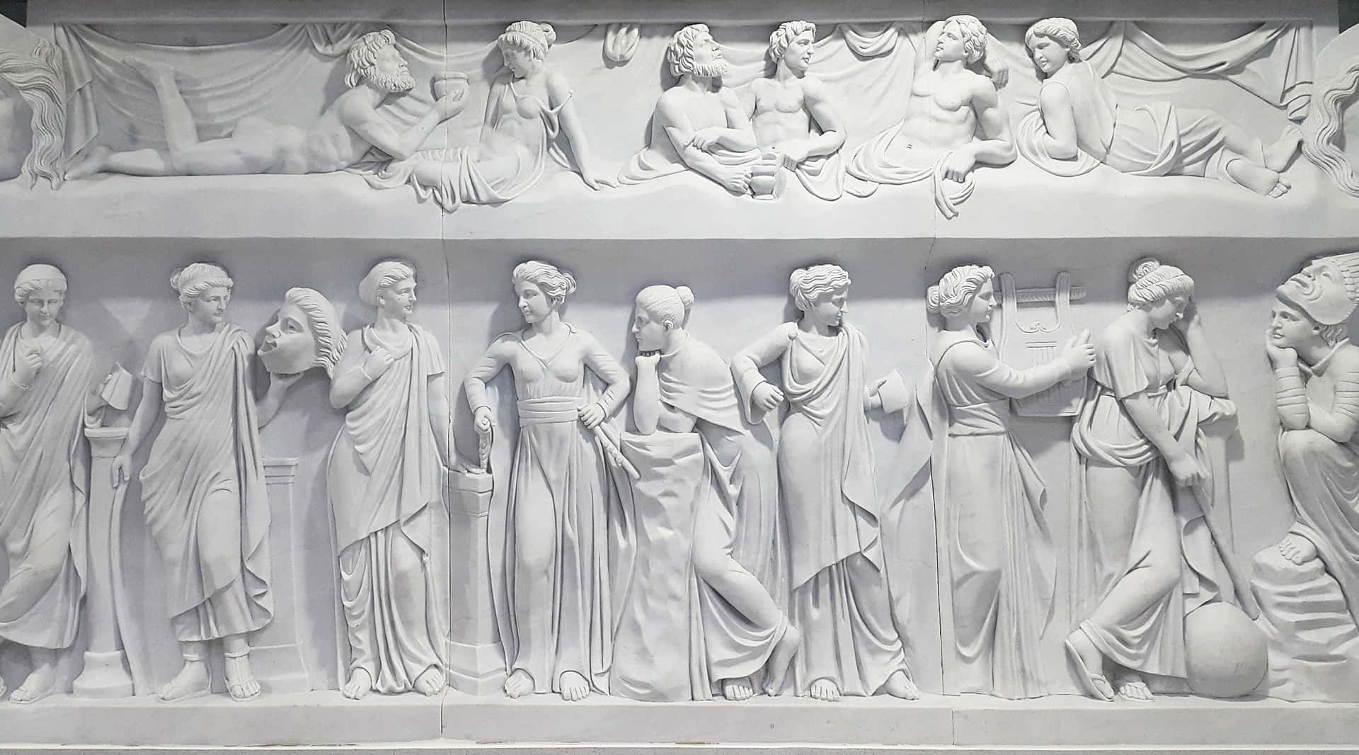 A White Marble Relief Depicting A Group Of People