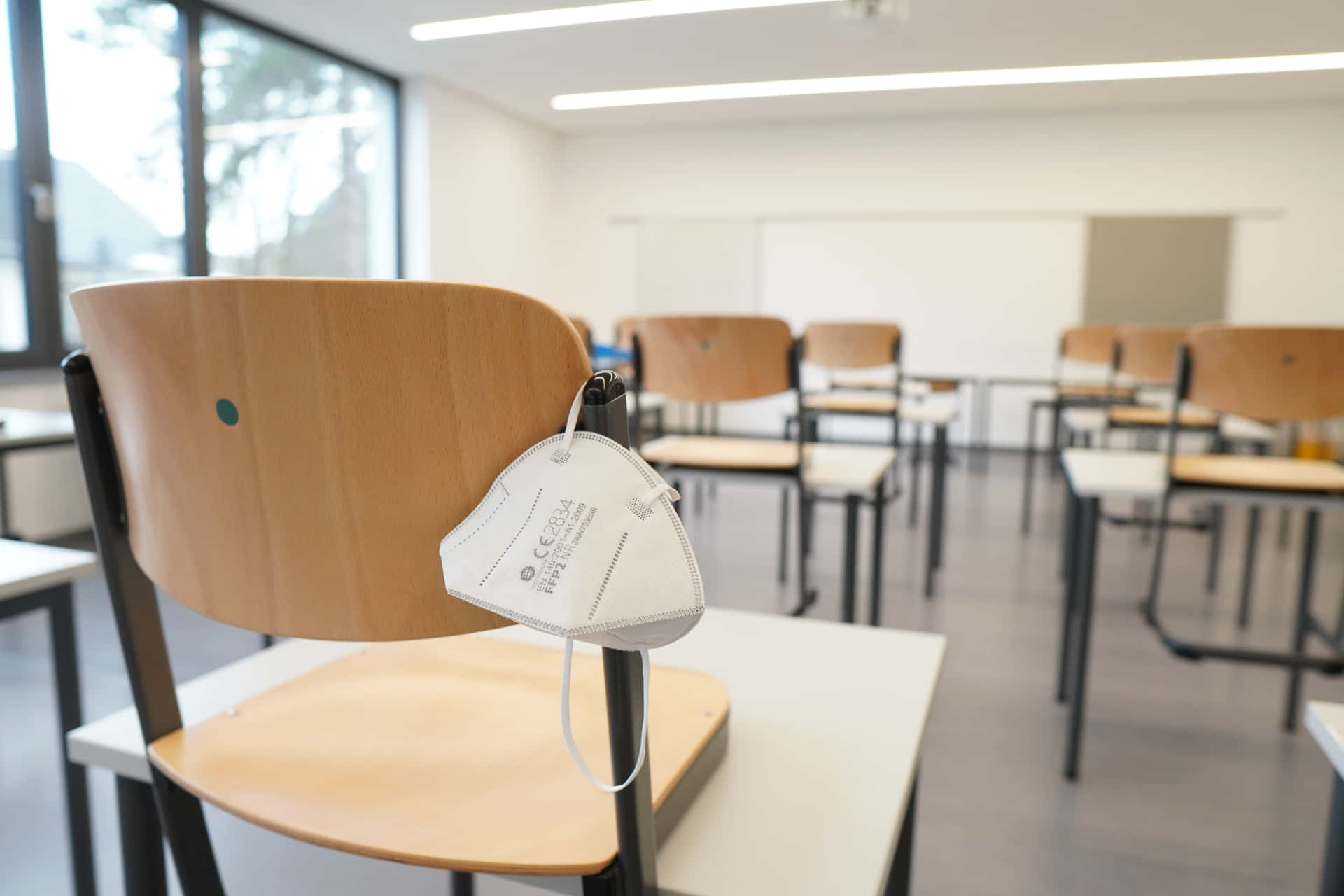 Chair With Mask In Classroom Background