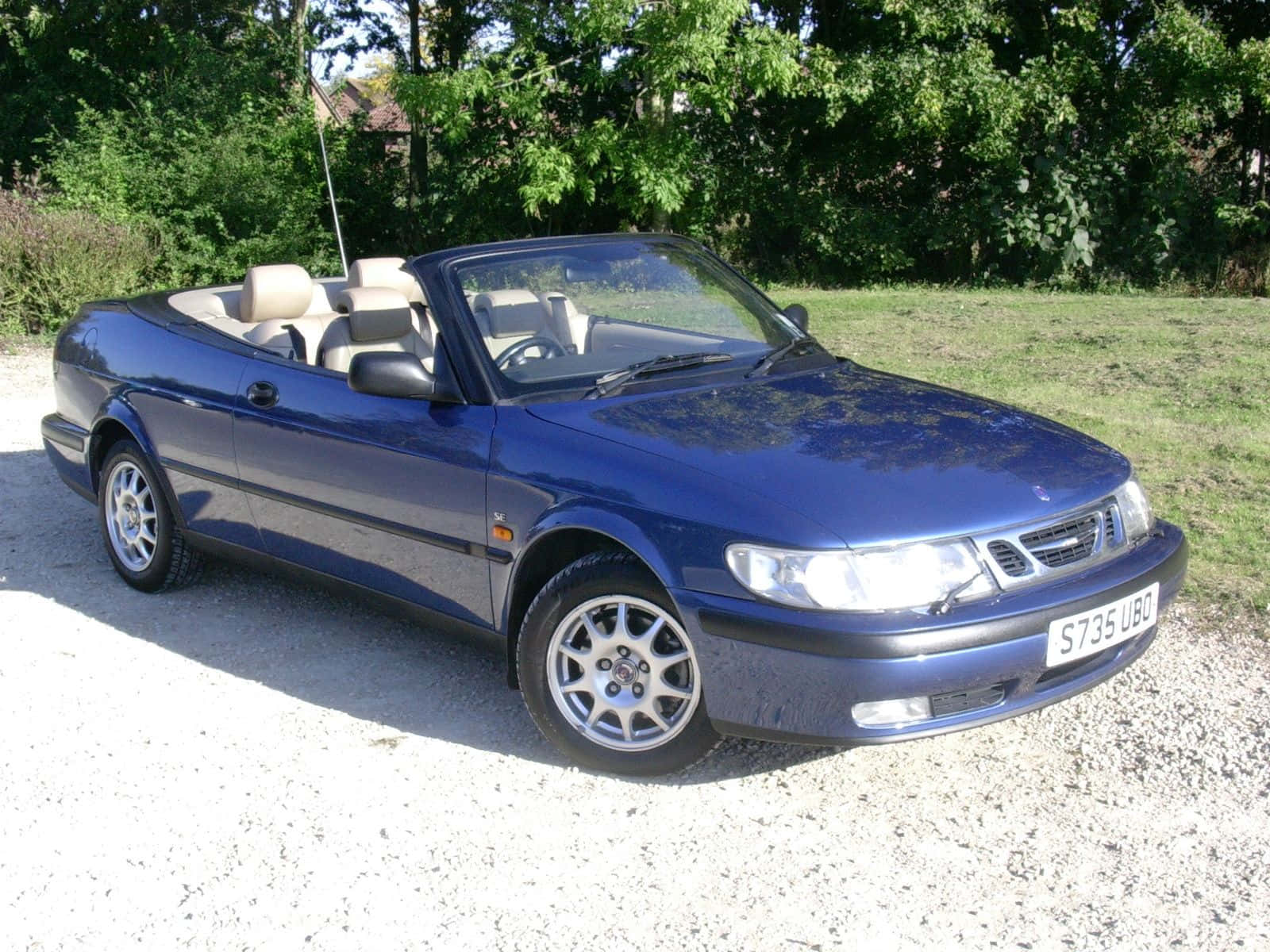 Classy Saab 9-3 Parked On A Serene Street Wallpaper