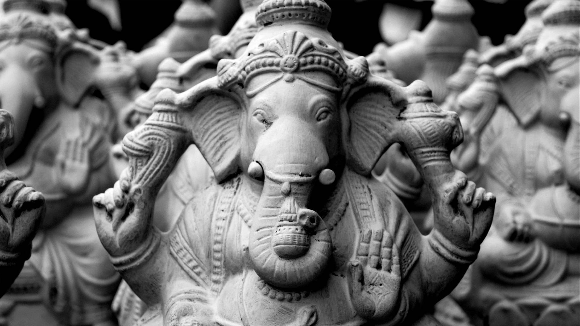 The Divine Artistry Captured: Black and White Clay Ganesh Wallpaper
