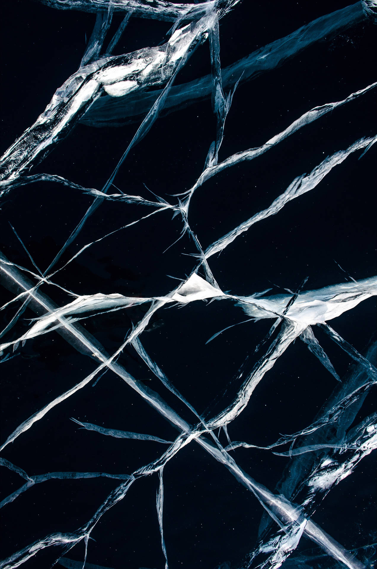 Clear Cracked Ice Over A Lake Wallpaper