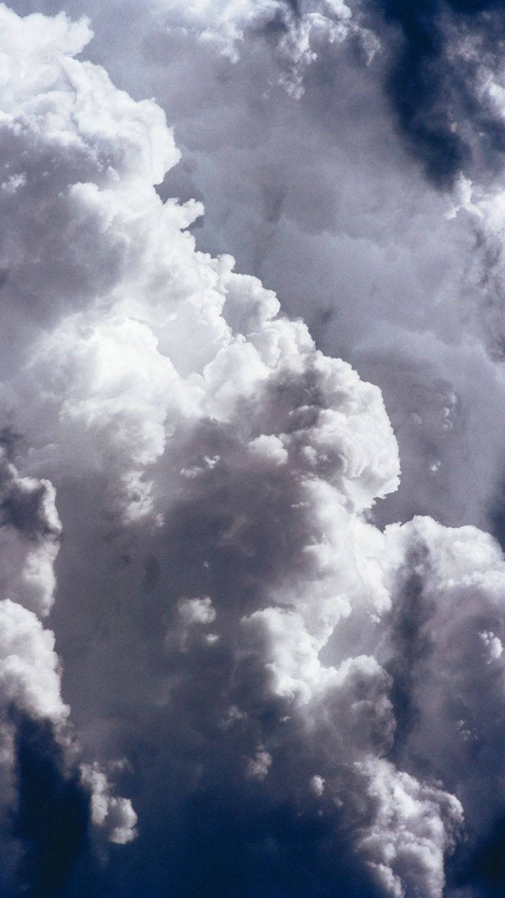 A beautiful sky filled with fluffy Cumulus clouds Wallpaper