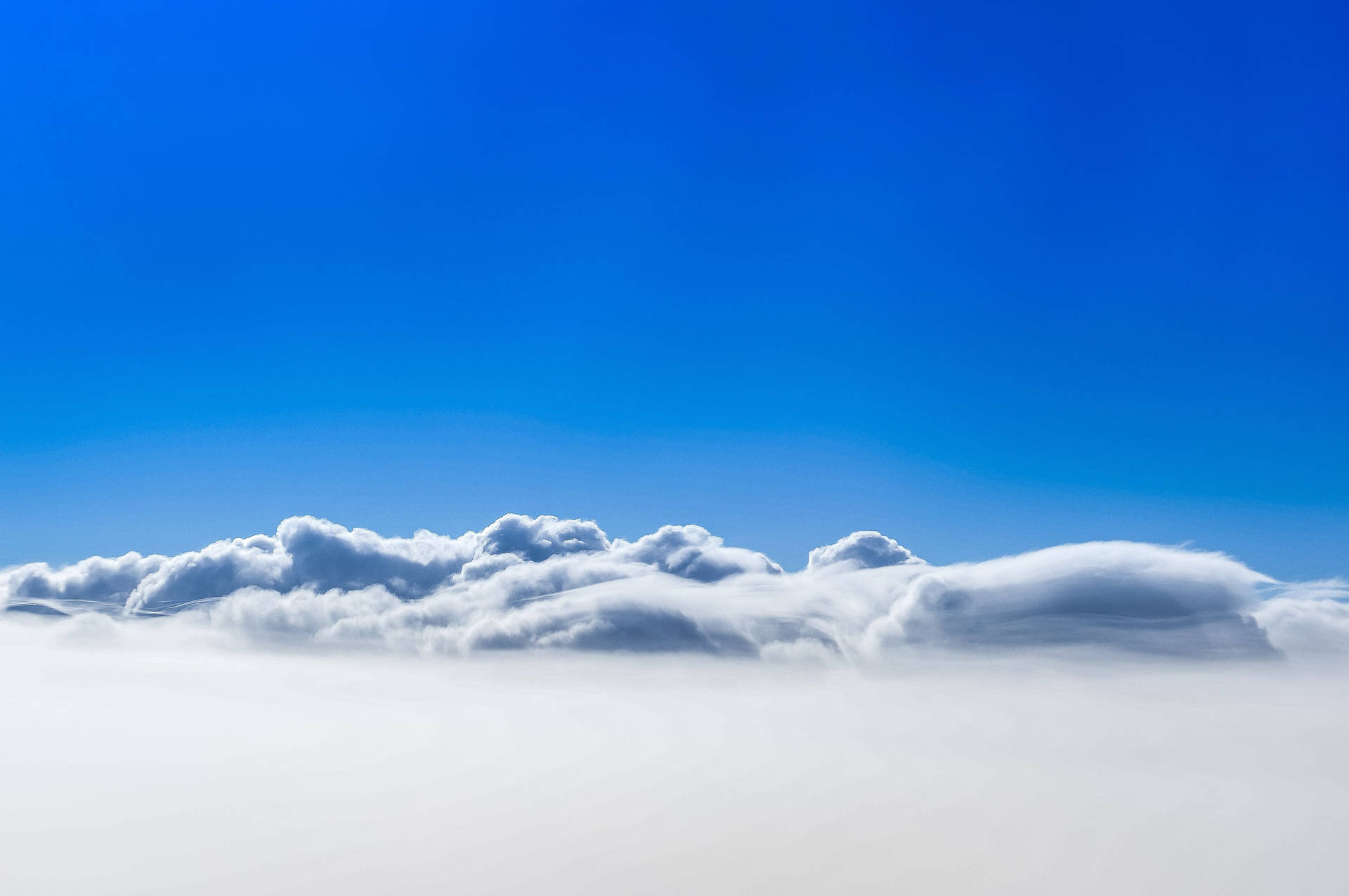 Clear Sky Over Clouds Wallpaper