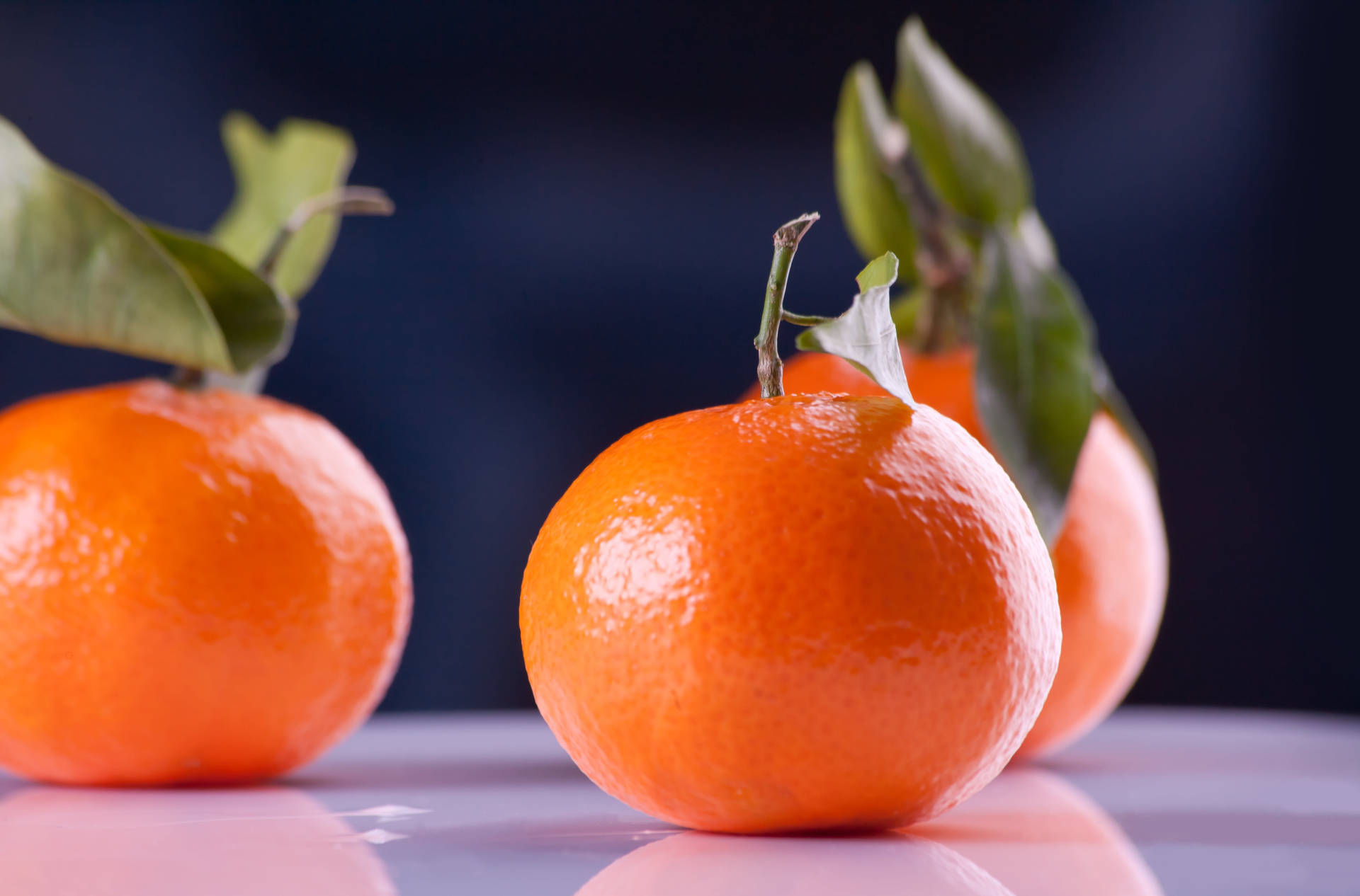 Clementine citrus frugter øjen niveau skud mørk baggrund Wallpaper
