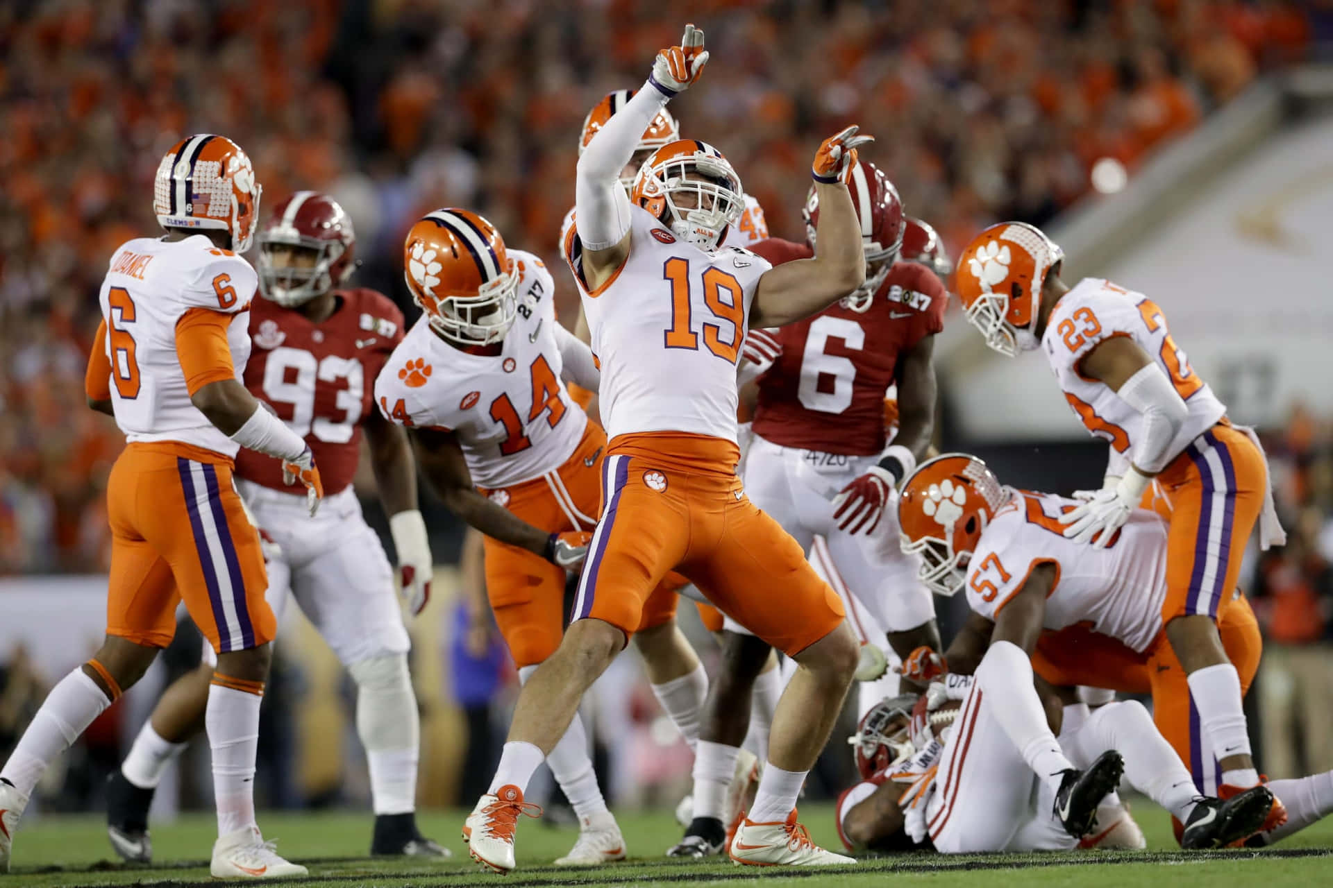 Caption: The Charge of the Clemson Tigers Football Team Wallpaper