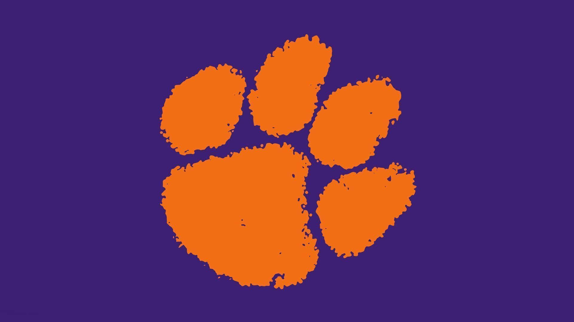 Clemsontigers Football Orange Paw Print Logo - Clemson Tigers Fotboll Orange Tassavtryck Logo Wallpaper