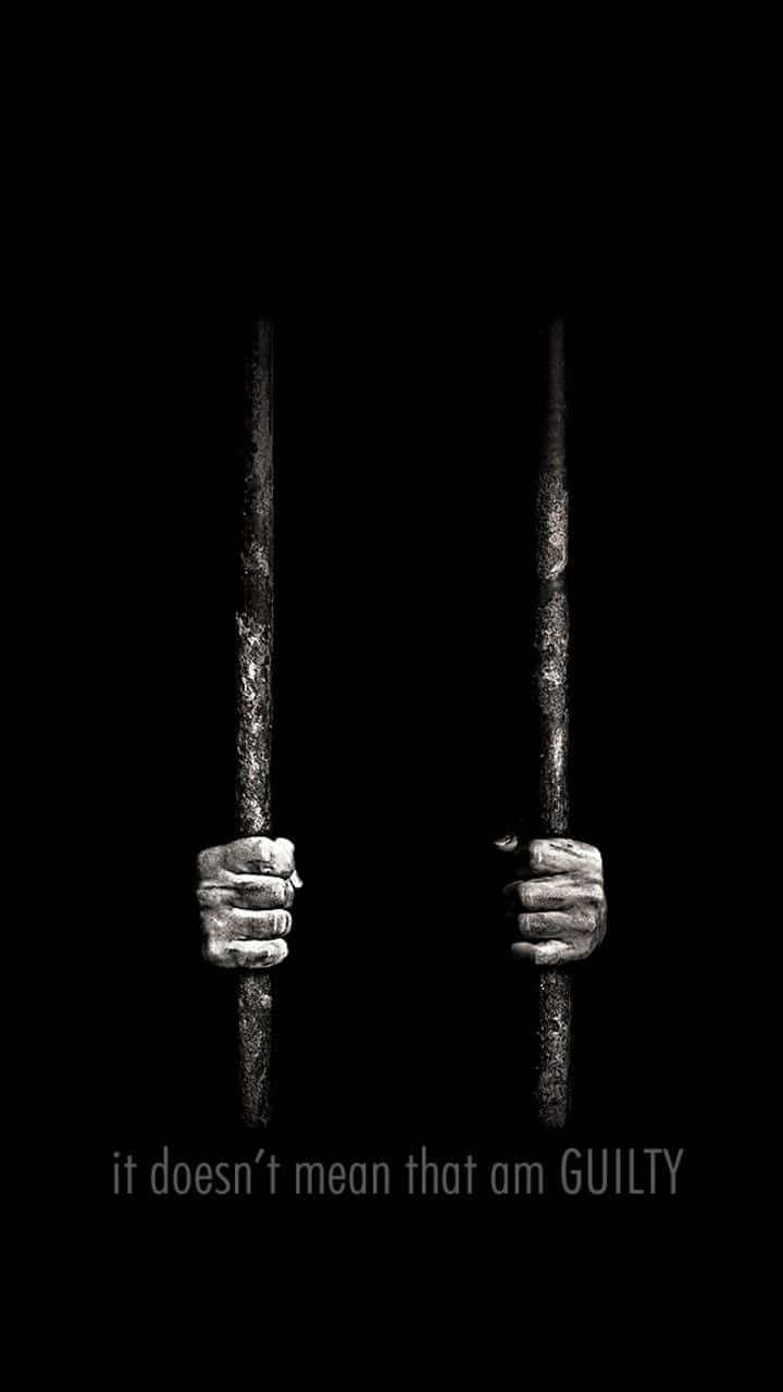 Clever Iphone With Hands Behind Bars Wallpaper