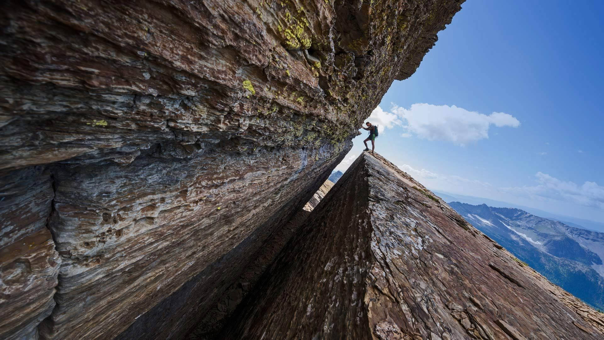 Climbing A Triangular Mountain Slope Wallpaper