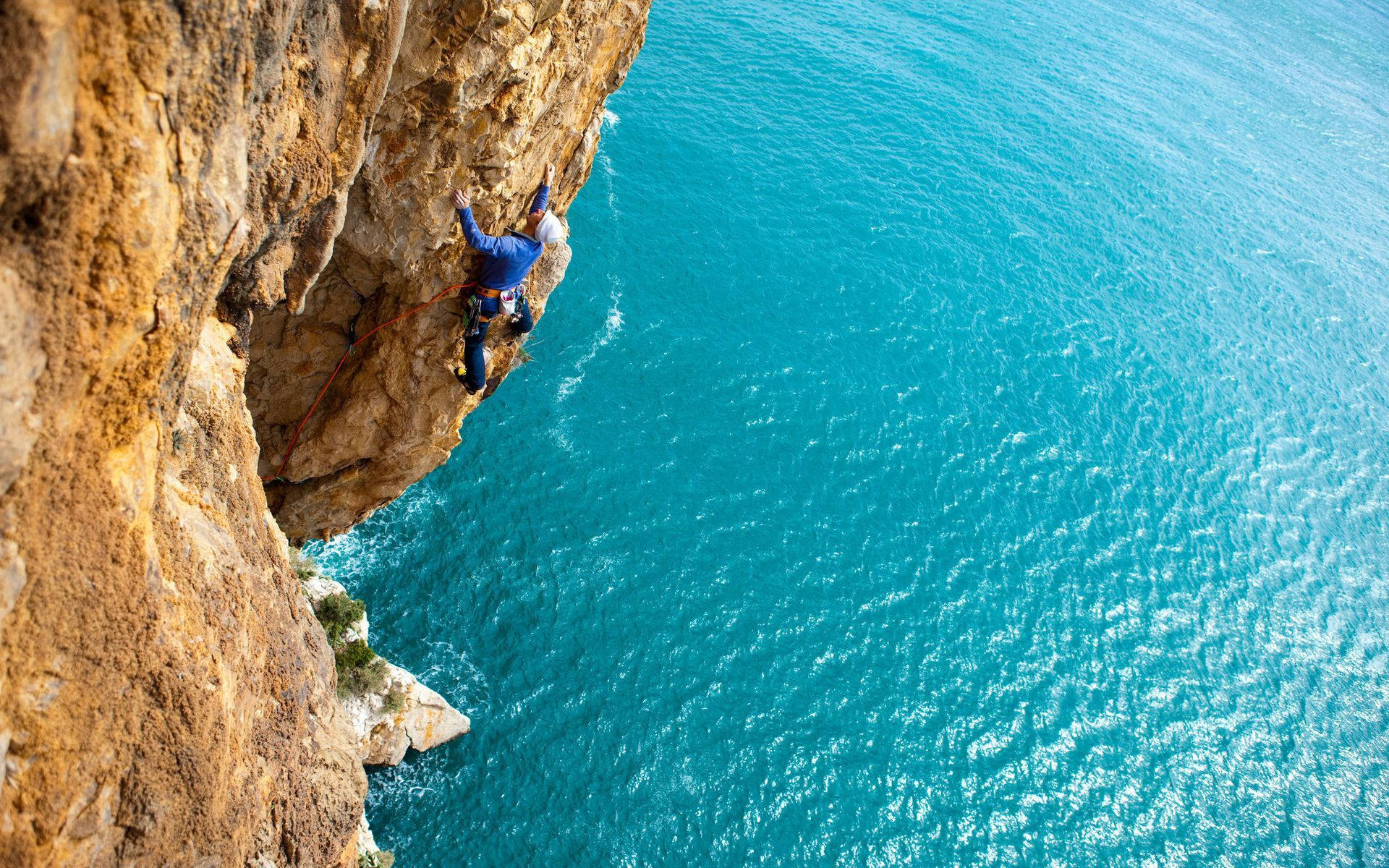 Climbing Man On A Cliff Wallpaper