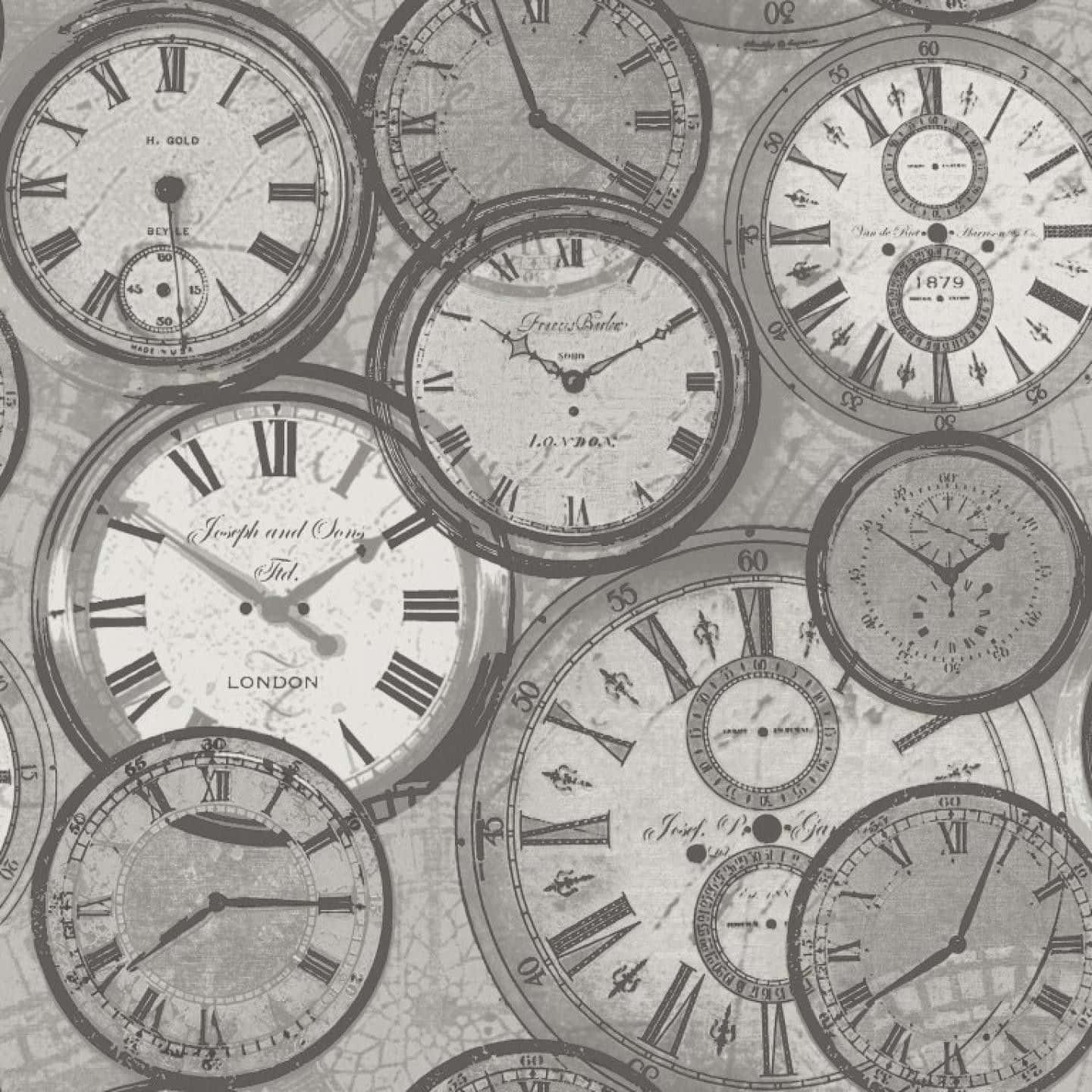 A Black And White Image Of Clocks On A Wall
