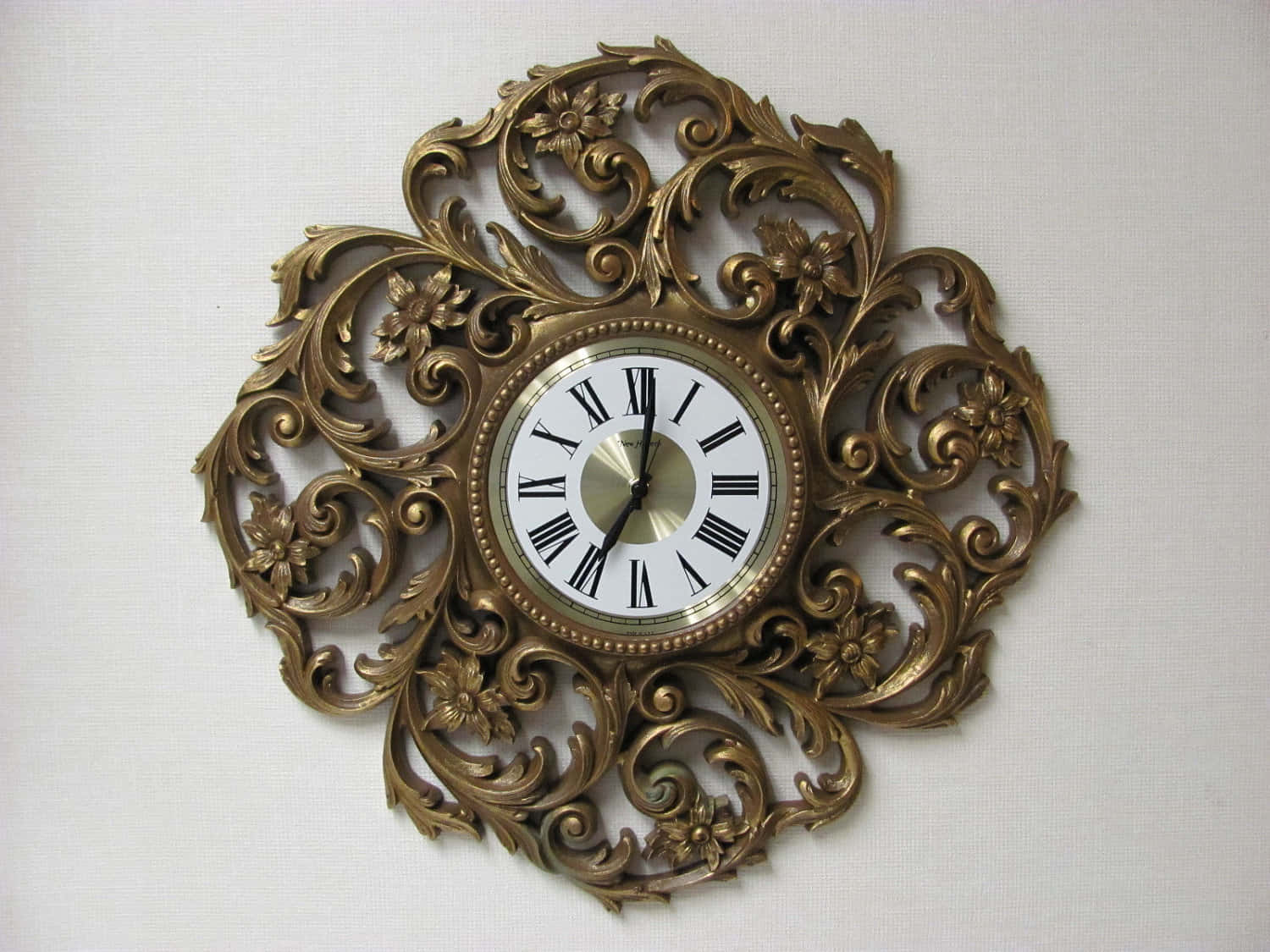 A Large Ornate Clock On A Wall
