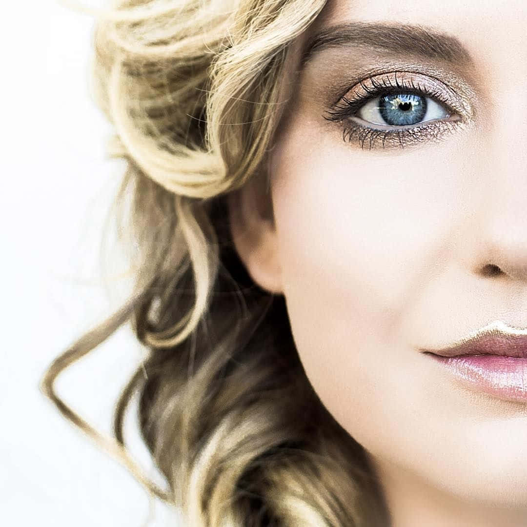 Close Up Blue Eyed Blonde Woman Wallpaper