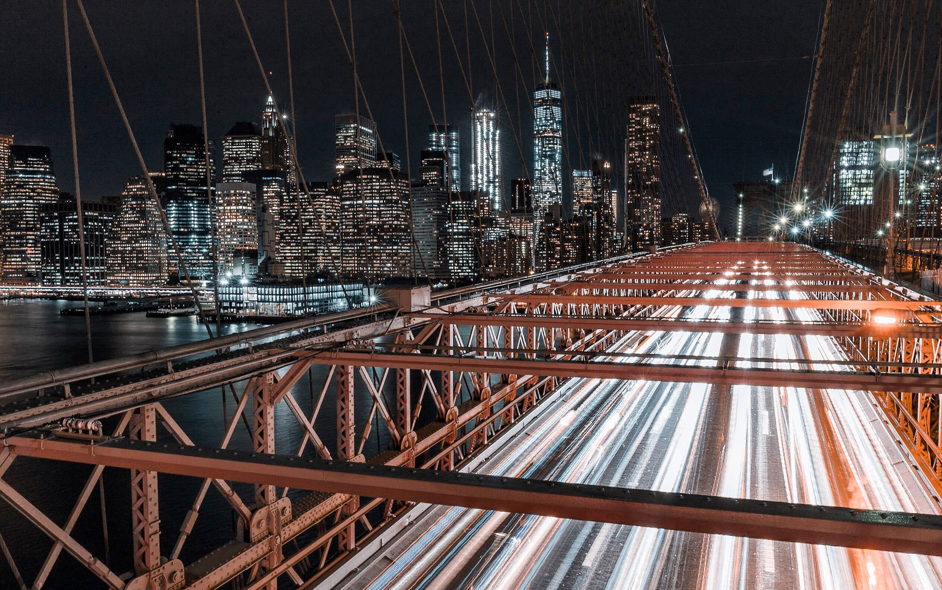 Nahaufnahmeder Nächtlichen Ansicht Der Brooklyn Bridge In New York City Wallpaper