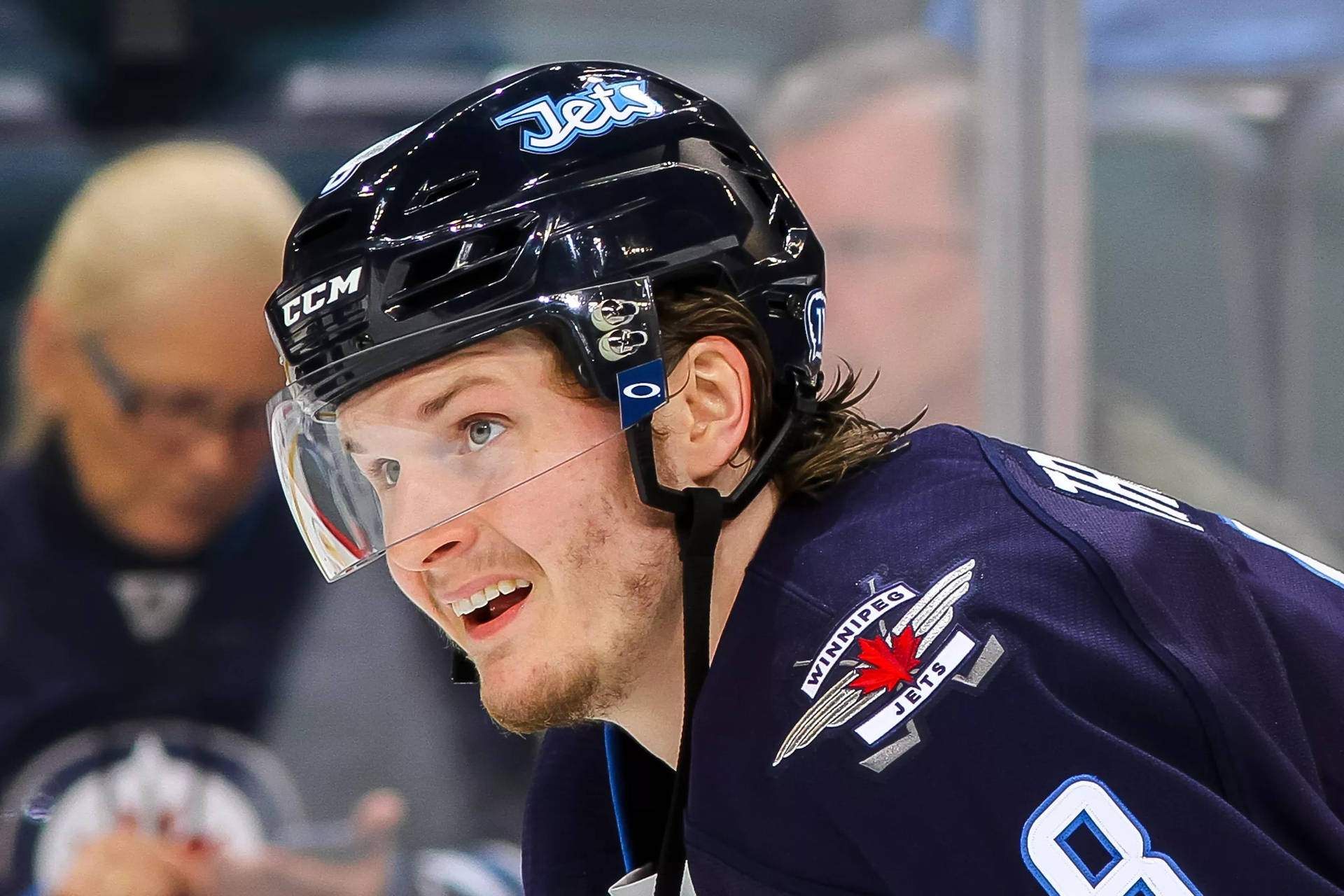 Close Up Look Of Jacob Trouba Smiling While Watching The Game Wallpaper