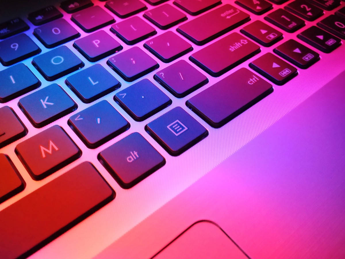 Close Up Neon Computer Keyboard Background