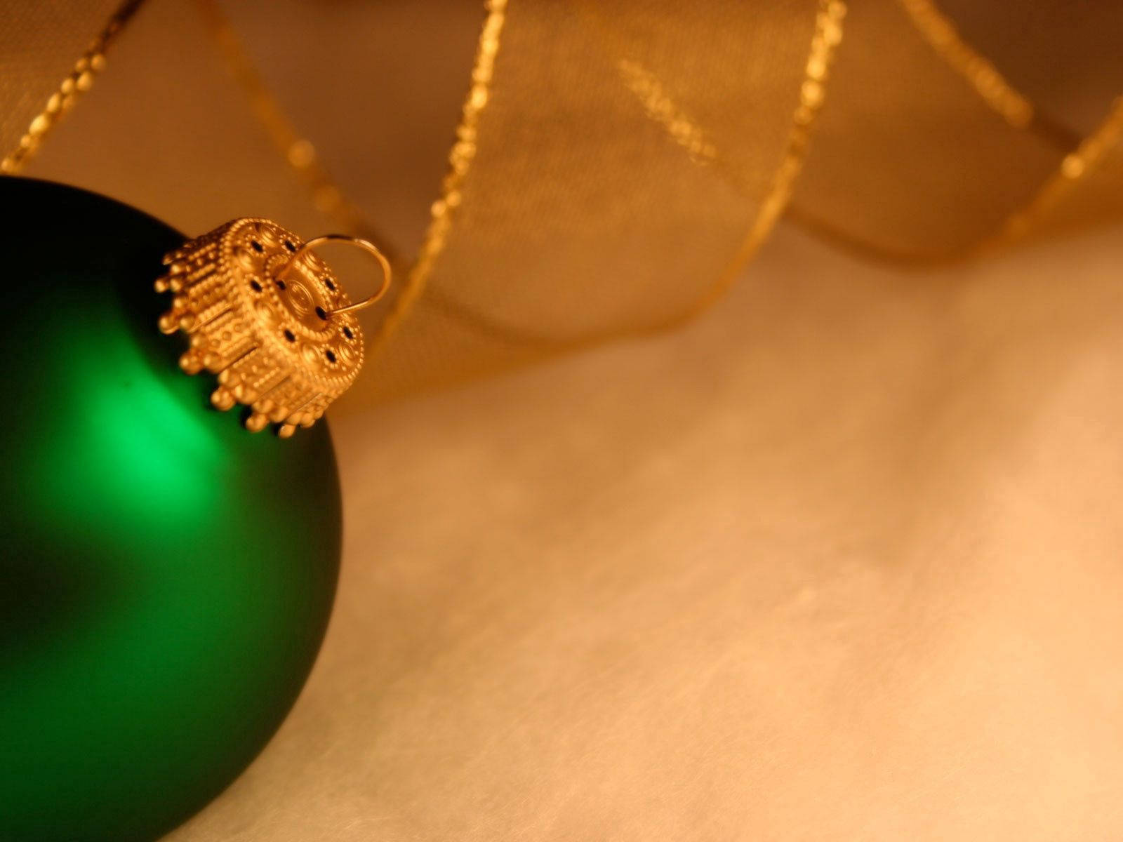 Close-up New Year's Green Ball Ornament Wallpaper