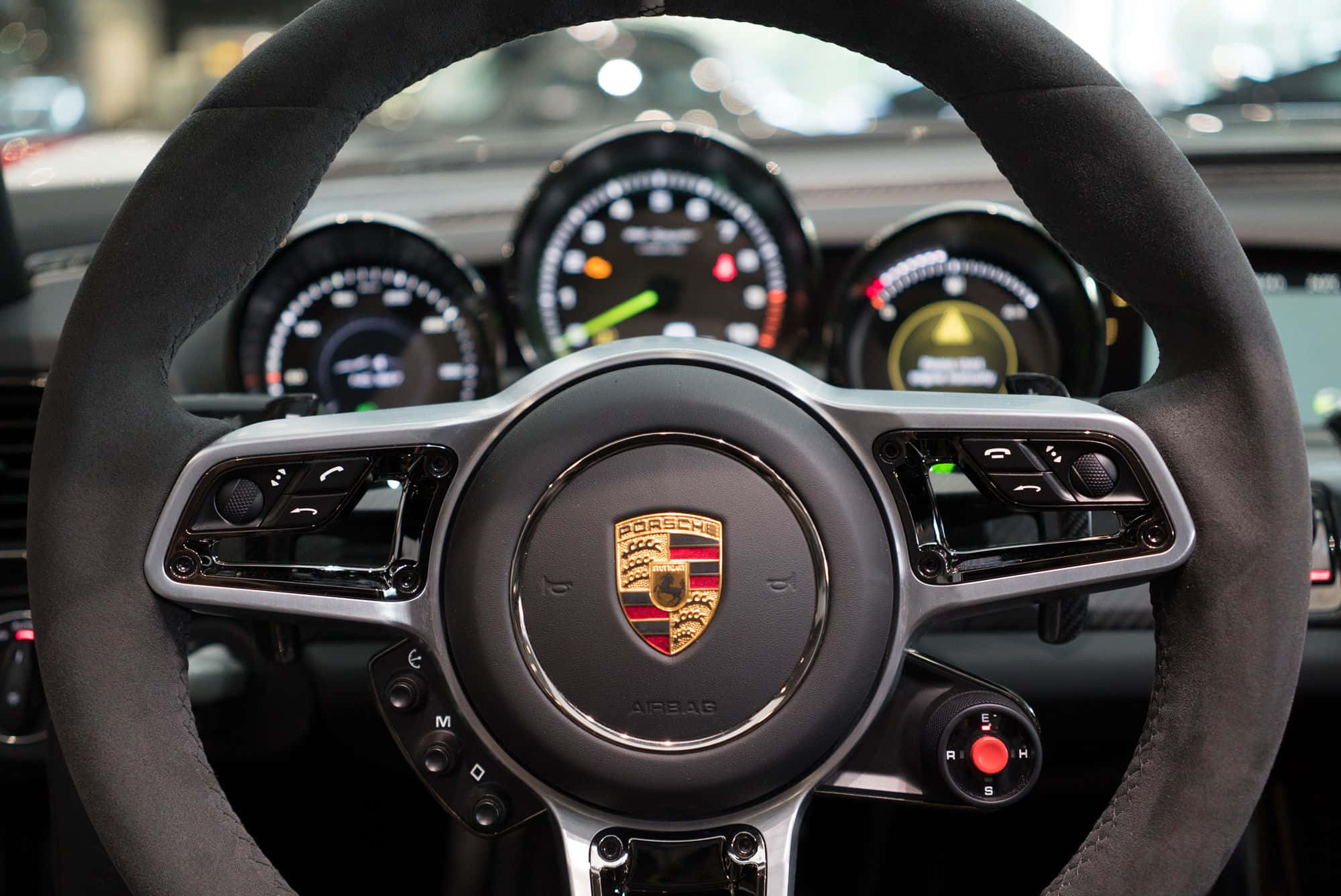 Close-up Of A Modern Car Steering Wheel Wallpaper