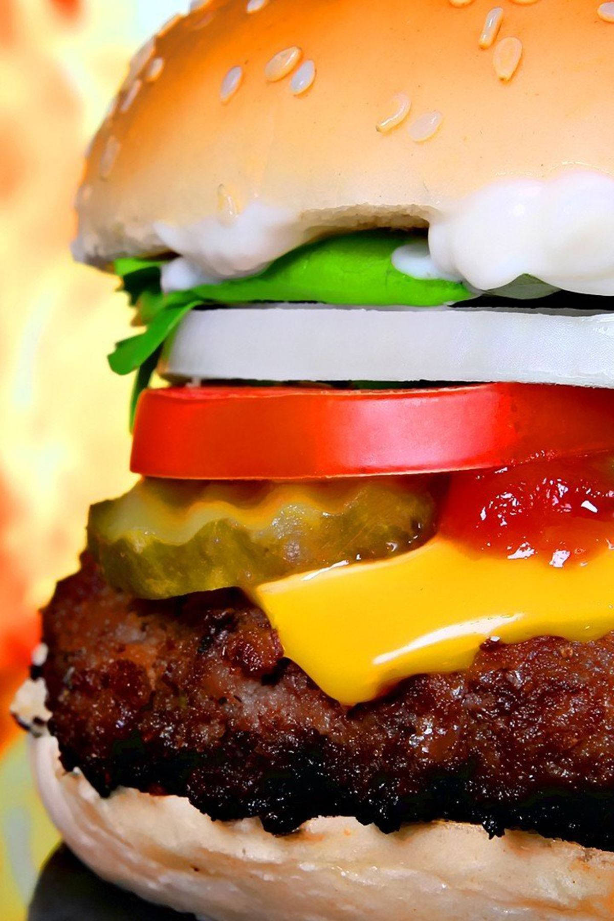 Savory Close-Up of a Delightful Cheeseburger Wallpaper