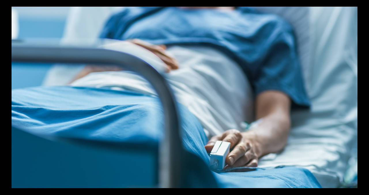 Close-Up Of a Patient in Hospital Bed Wallpaper