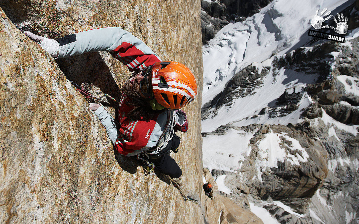 Ultimate Adventure: Man Rock Climbing Wallpaper