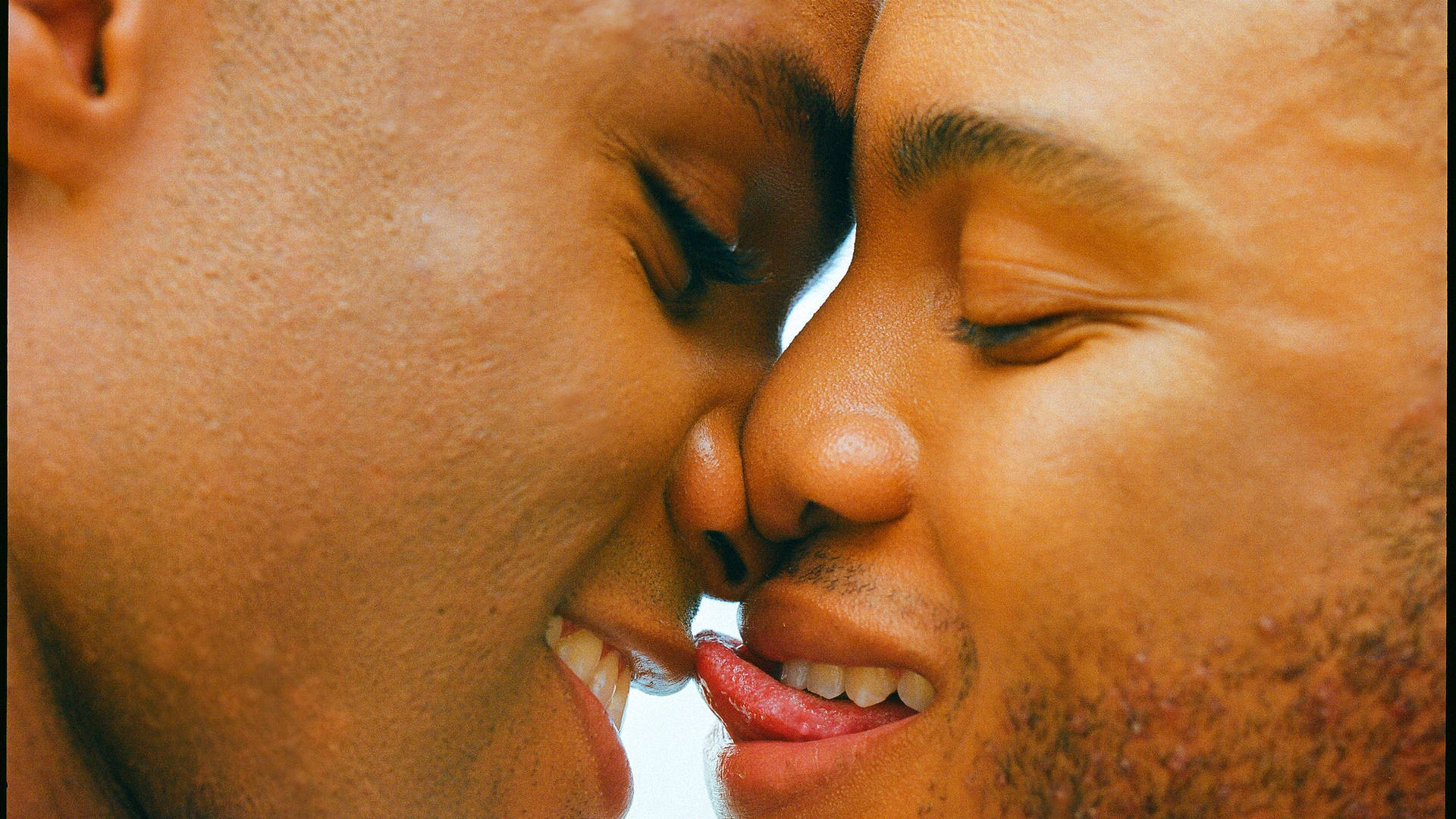 Close-up Shot Of A Black Gay Man Wallpaper